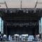 Concert stage rental providers setting up a mobile stage at an event